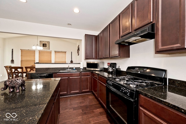 kitchen with black appliances, dark stone countertops, an inviting chandelier, decorative light fixtures, and dark hardwood / wood-style flooring