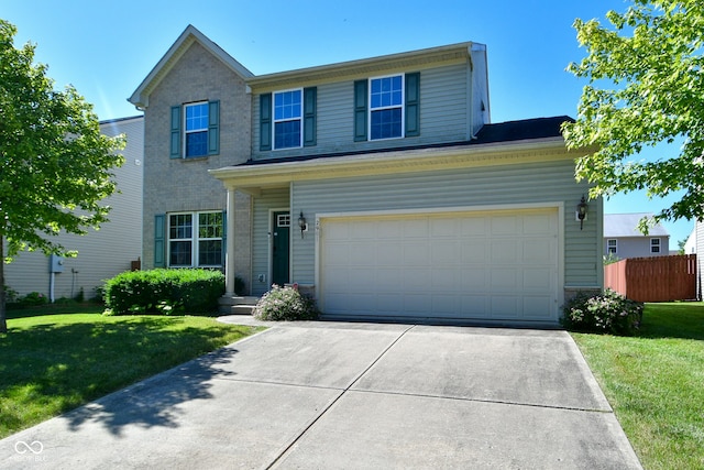 view of front property featuring a garage and a front yard