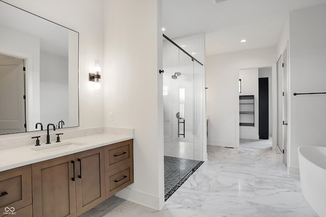 bathroom featuring vanity and a shower with shower door