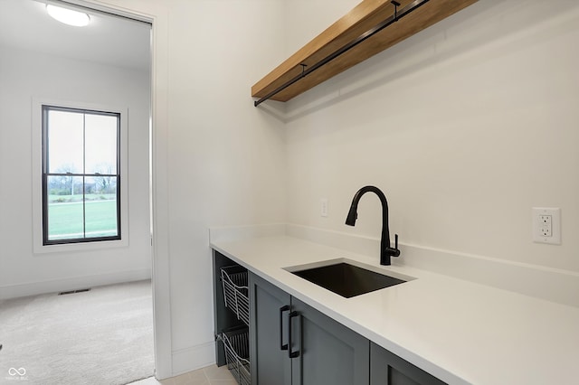 interior space with sink and light carpet