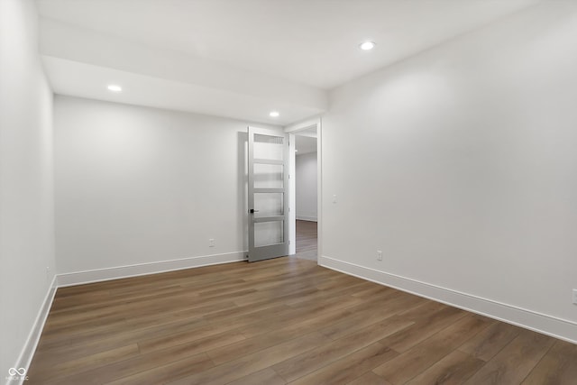 spare room featuring dark wood-type flooring