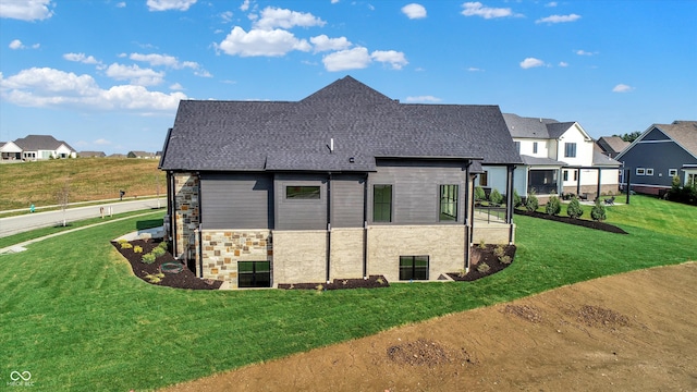 view of side of home featuring a yard