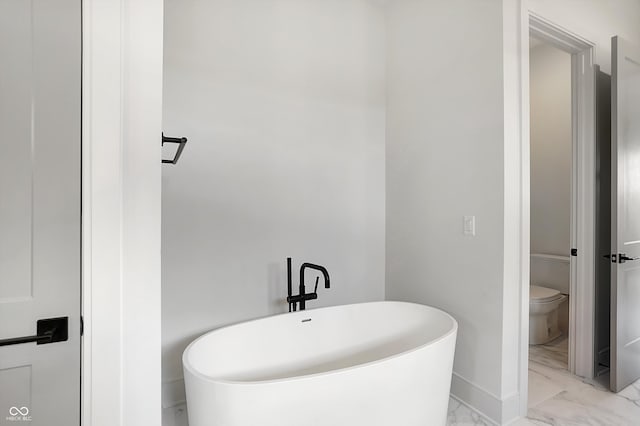 bathroom featuring toilet and a bathing tub