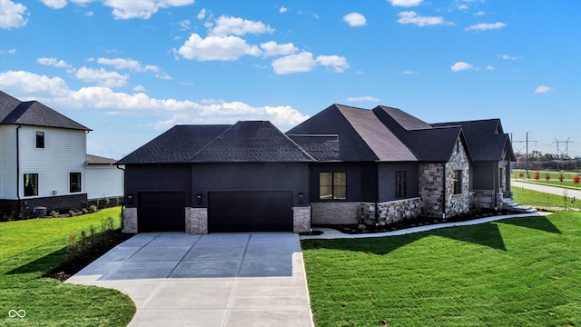 view of front facade with a garage and a front yard