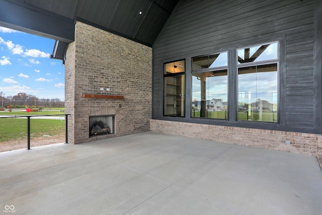 view of patio / terrace with an outdoor brick fireplace