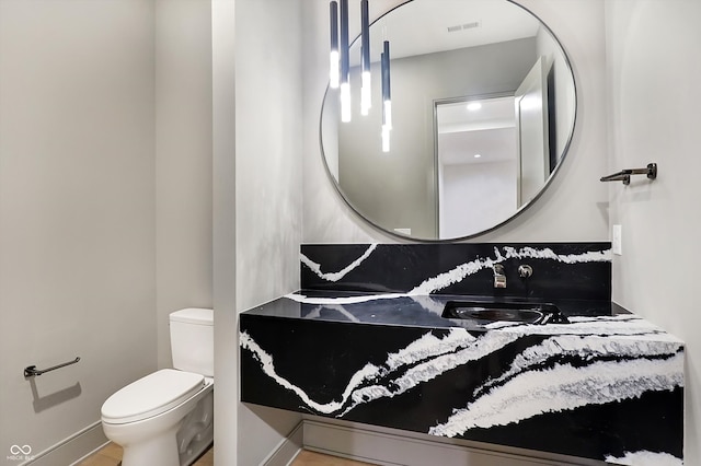 bathroom with sink and toilet