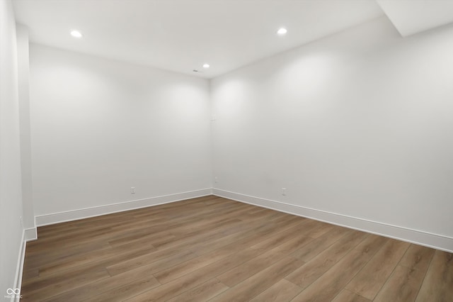 unfurnished room featuring hardwood / wood-style flooring