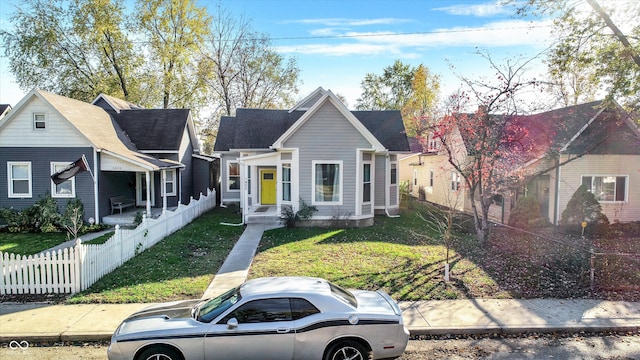 bungalow-style house featuring a front lawn