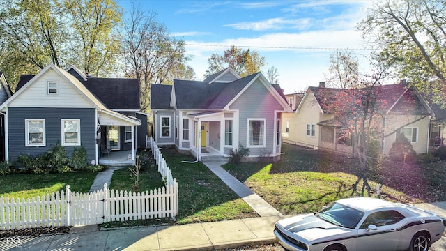 view of front facade featuring a front lawn and covered porch