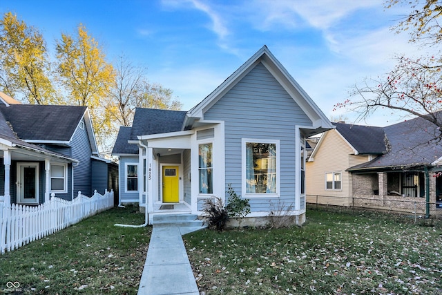 bungalow-style house featuring a front yard