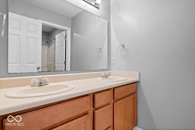 bathroom with vanity and a shower