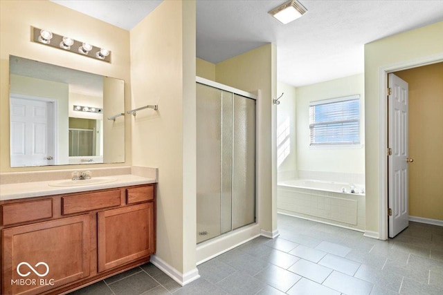 bathroom featuring vanity, tile patterned flooring, and independent shower and bath