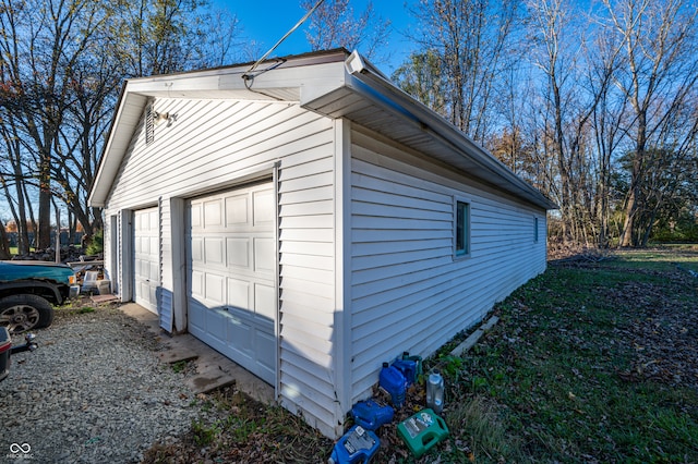 view of side of home featuring a garage