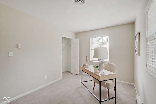 carpeted home office with a baseboard heating unit