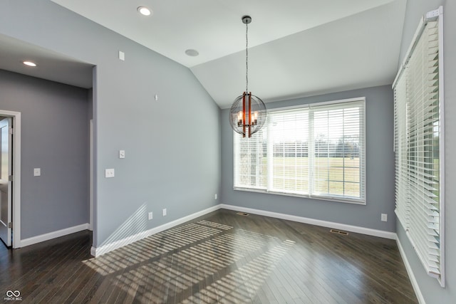 unfurnished dining area with a notable chandelier, dark wood-type flooring, and vaulted ceiling