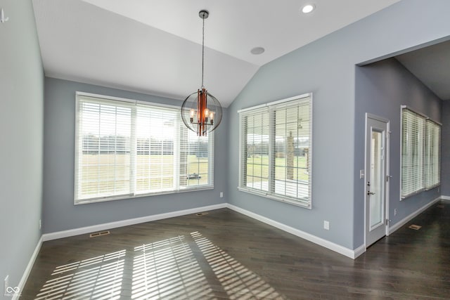 unfurnished dining area with dark hardwood / wood-style flooring, an inviting chandelier, and a healthy amount of sunlight