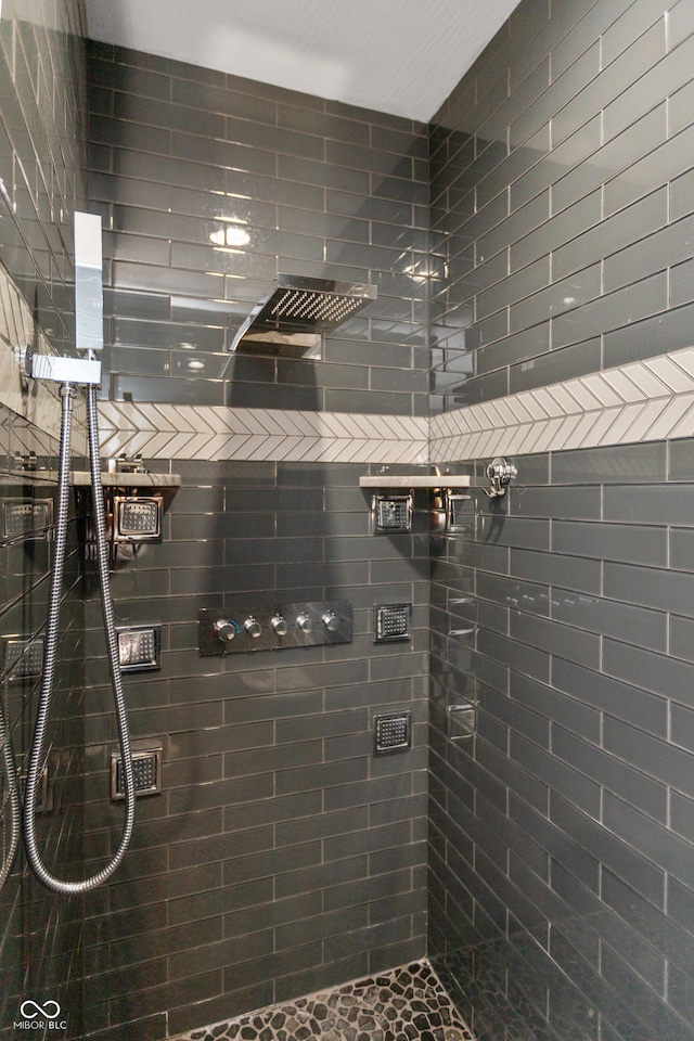 bathroom with tiled shower