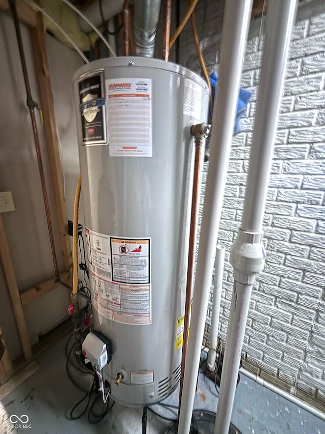 utility room featuring gas water heater