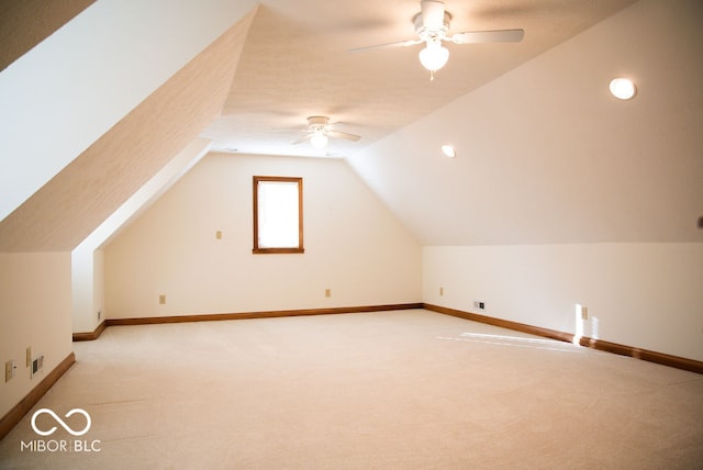 additional living space with light carpet, ceiling fan, and lofted ceiling