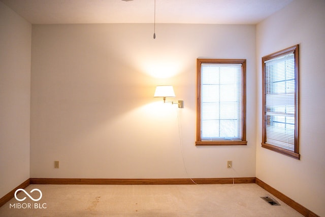 empty room featuring light carpet