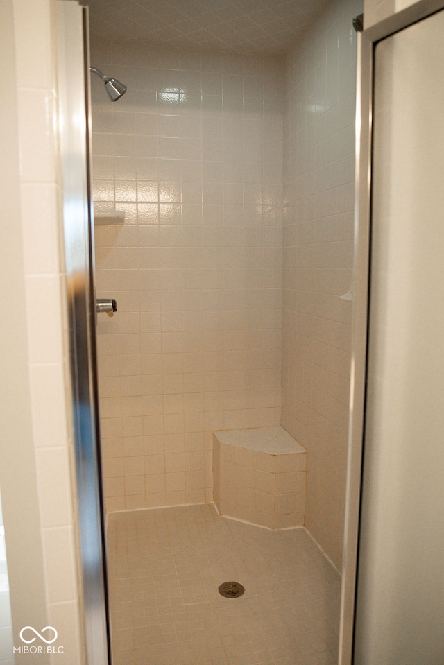 bathroom with tiled shower