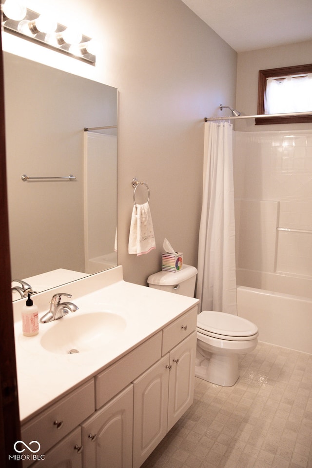 full bathroom with vanity, toilet, and shower / tub combo