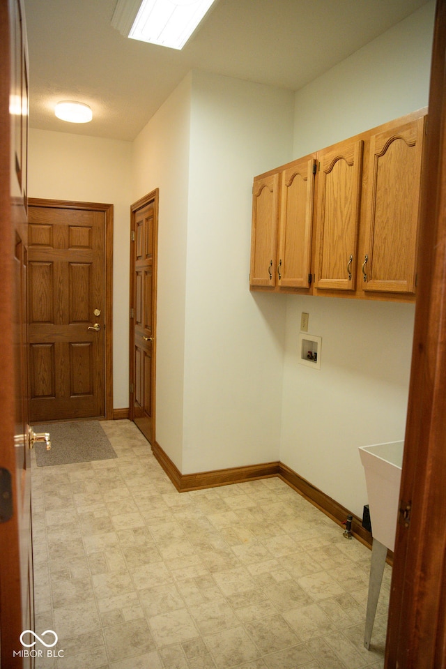 laundry room with cabinets and hookup for a washing machine