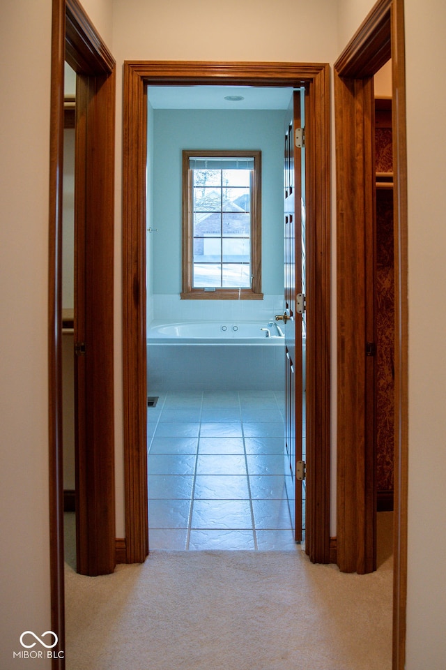 hallway with carpet flooring