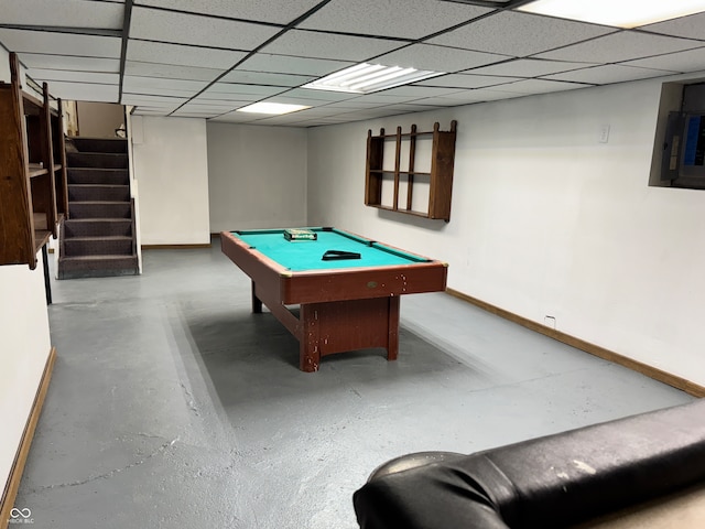 playroom featuring a paneled ceiling, concrete flooring, and billiards