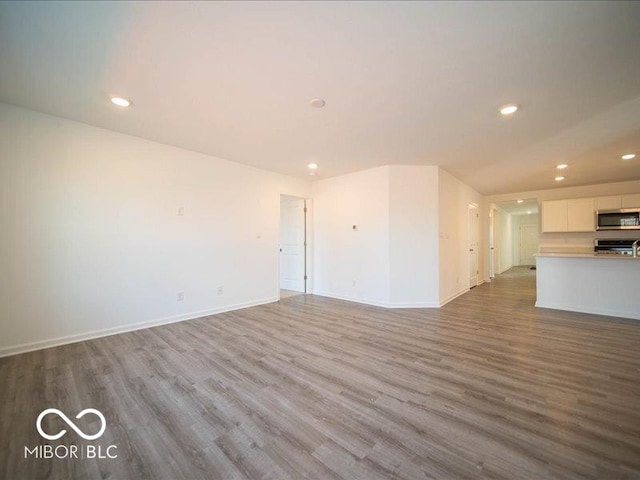 unfurnished living room featuring light hardwood / wood-style floors