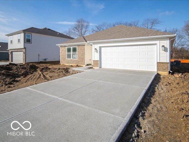 ranch-style house featuring a garage