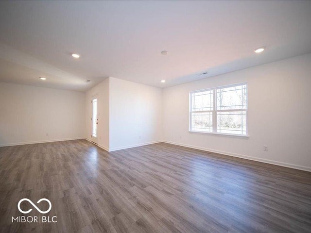 empty room featuring dark wood-type flooring