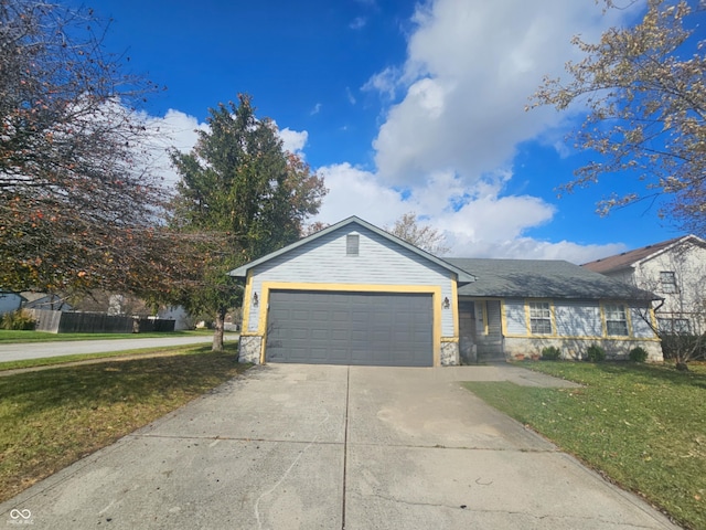 ranch-style home with a garage and a front lawn