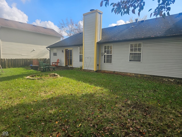 back of house featuring a patio area and a yard