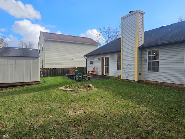 back of house with a lawn and a patio area