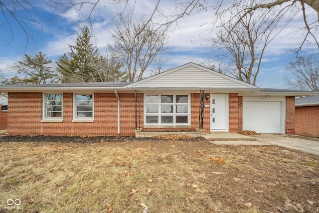 ranch-style home featuring a garage, concrete driveway, and brick siding