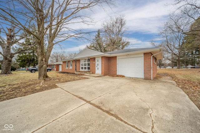 ranch-style home featuring concrete driveway, brick siding, and an attached garage