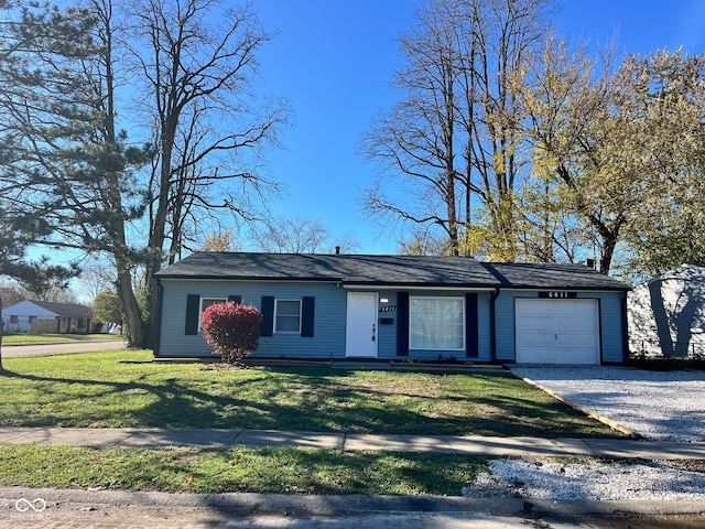 single story home with a garage and a front yard