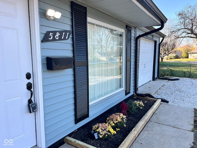 property entrance with a garage