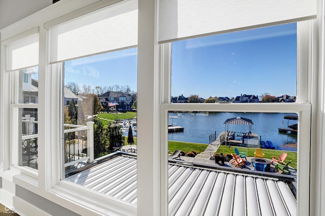 doorway to outside with a water view