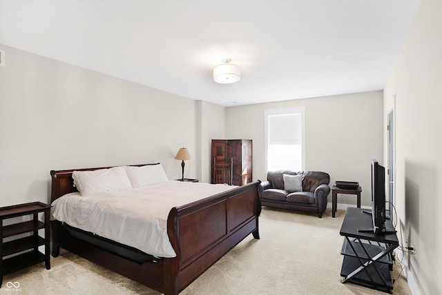 bedroom featuring light carpet