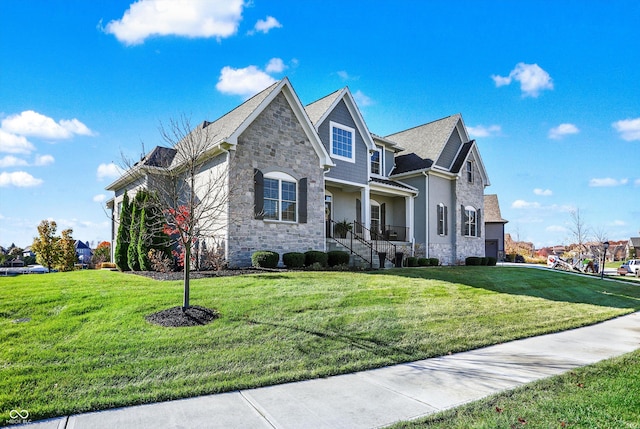 view of front of home with covered porch and a front yard