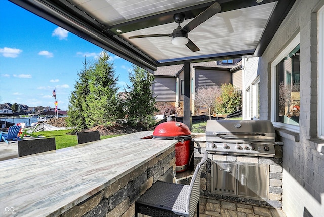 view of patio with area for grilling and exterior bar