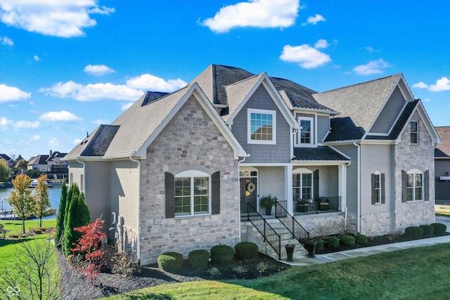 view of front of house featuring a front yard and a porch