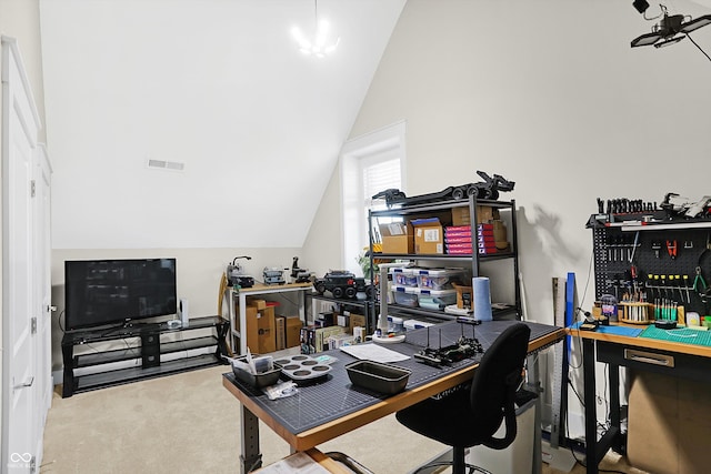 home office with carpet flooring and vaulted ceiling