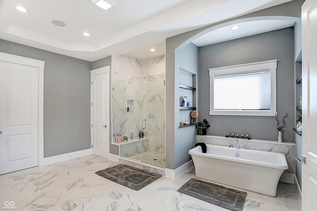 bathroom featuring shower with separate bathtub