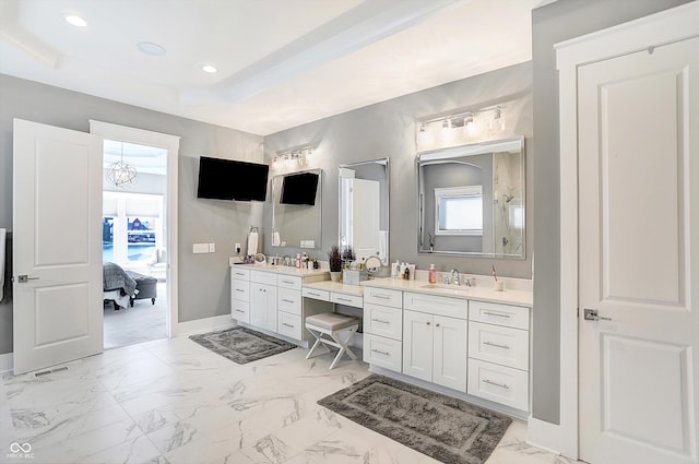 bathroom featuring a shower and vanity