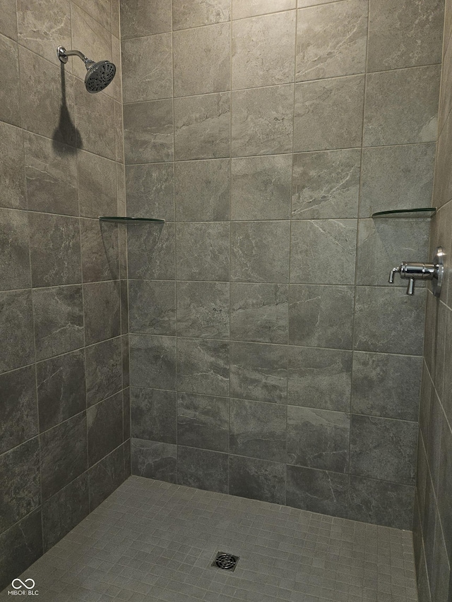 bathroom with tiled shower