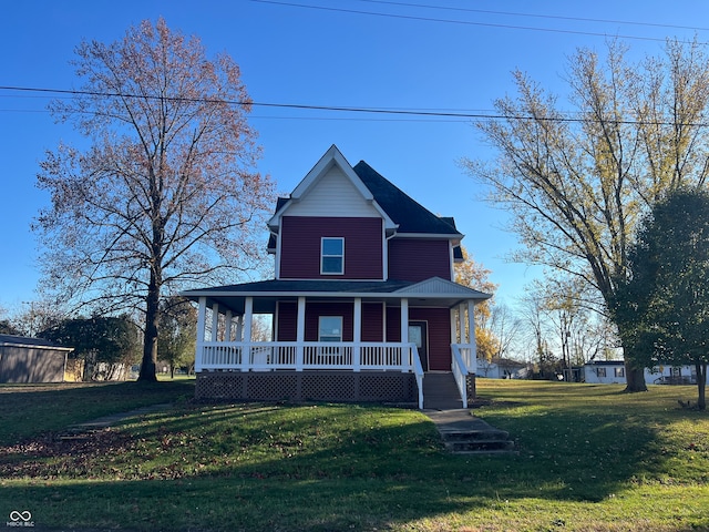 view of front facade featuring a front yard and covered porch