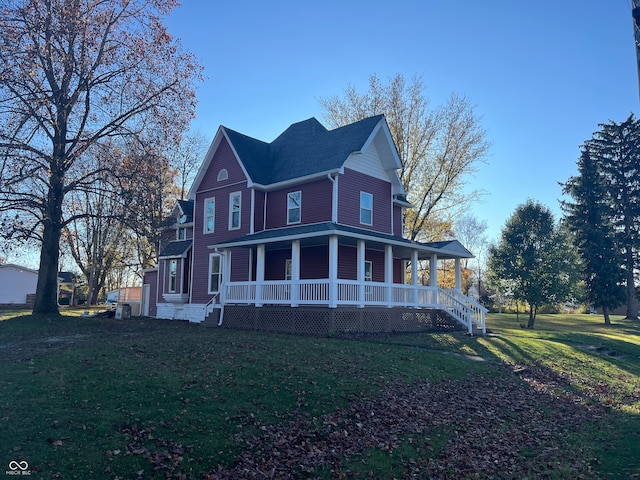 view of front of home with a porch and a front lawn